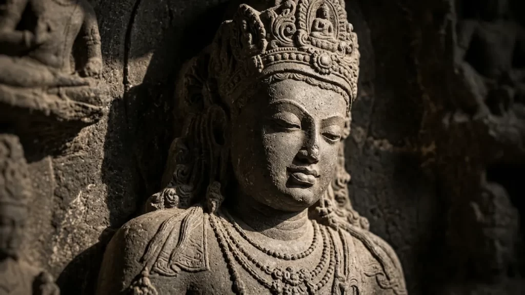 Bodhisattva relief detail at Aurangabad Caves Cave 3 — sunrise sidelight on carved stone, Maharashtra
